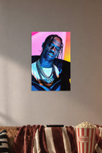 Travis Scott in a cozy movie room above a brown sofa with popcorn.