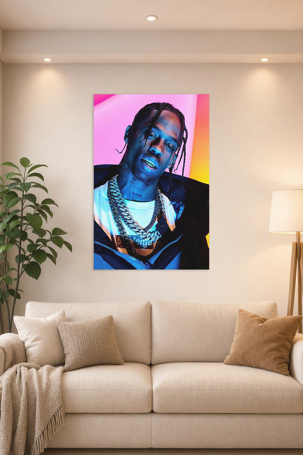 Travis Scott in a bright living room above a beige sofa.