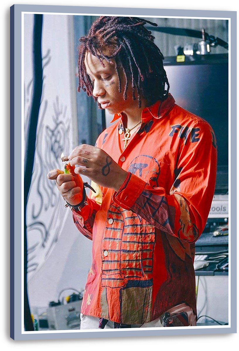 Trippie Redd canvas wall art print featuring the rapper in a red patterned shirt, hands together beside studio equipment, presented with wrapped edges.