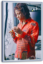 Trippie Redd canvas wall art print featuring the rapper in a red patterned shirt, hands together beside studio equipment, presented with wrapped edges.