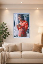 Trippie Redd in a bright living room above a beige sofa.