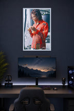 Trippie Redd in a gaming desk setup above a monitor.