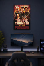 Tropic Thunder Movie Poster in a gaming desk setup above a monitor.