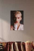 Troye Sivan in a cozy movie room above a brown sofa with popcorn.