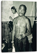 Tupac Shakur canvas wall art displays a monochrome backstage-style portrait with tattoos, jewelry, and another man behind him.