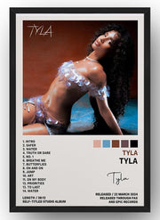 Tyla framed wall art print with a black border, depicting a reclining woman, color swatches, track list, and album release text.
