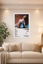 Tyla Tyla Poster Album Cover Posters for in a bright living room above a beige sofa.