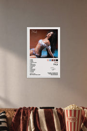 Tyla Tyla Poster Album Cover Posters for in a cozy movie room above a brown sofa with popcorn.