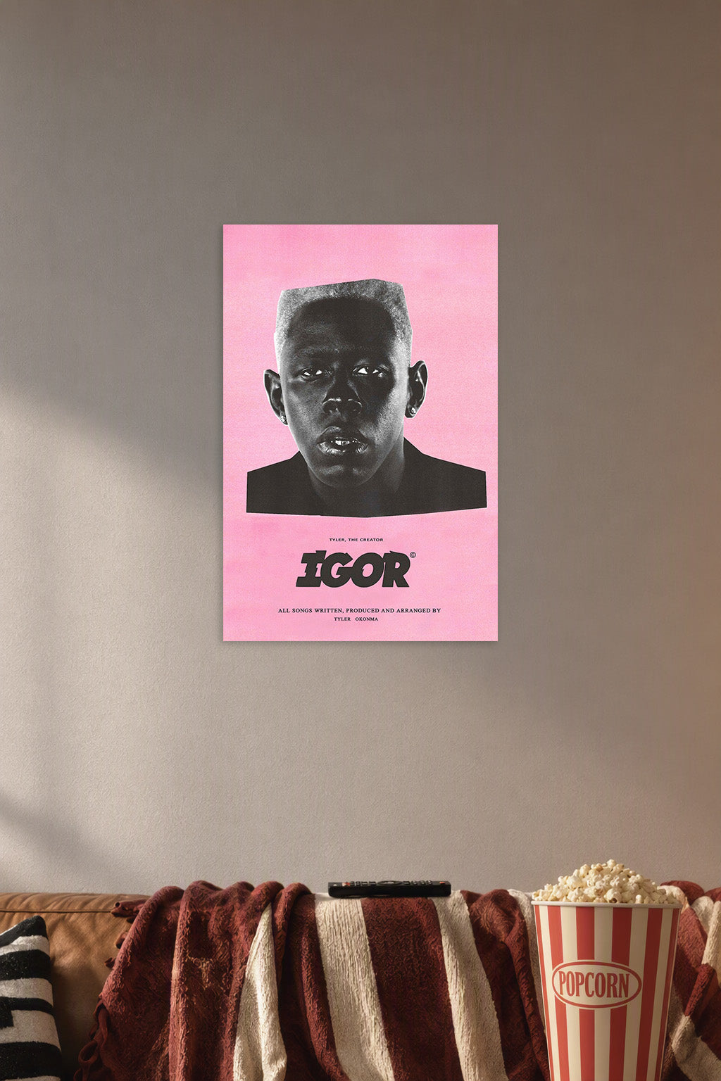 Tyler, The Creator IGOR Album Art in a cozy movie room above a brown sofa with popcorn.