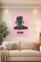 Tyler, The Creator IGOR Album Art in a bright living room above a beige sofa.