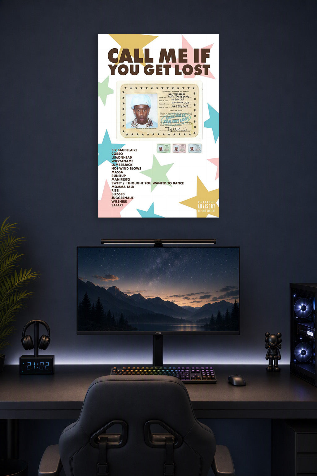 Tyler, The Creator Sir Baudelaire CALL ME IF YOU GET LOST in a gaming desk setup above a monitor.