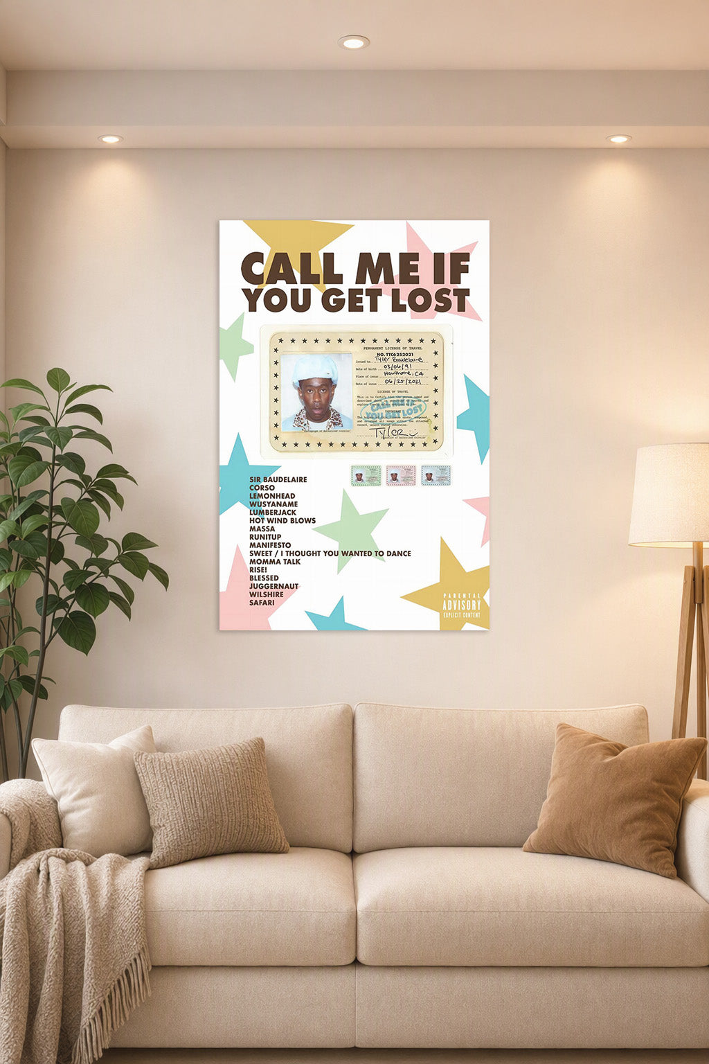 Tyler, The Creator Sir Baudelaire CALL ME IF YOU GET LOST in a bright living room above a beige sofa.