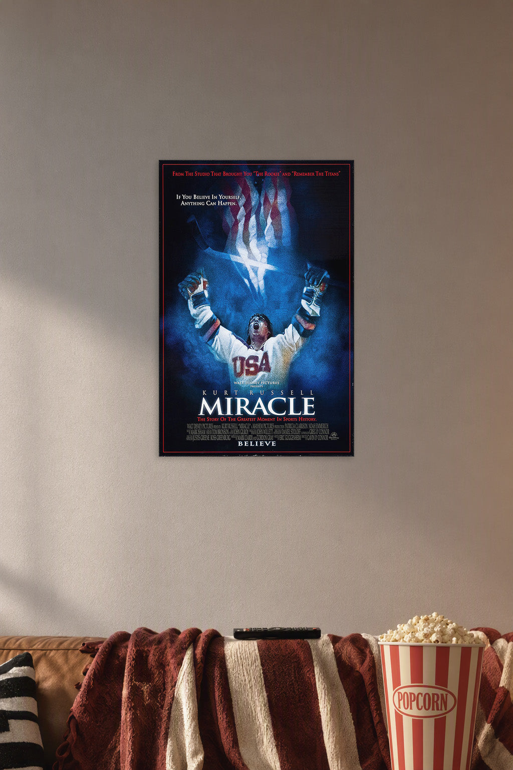USA Hockey Miracle Victory in a cozy movie room above a brown sofa with popcorn.