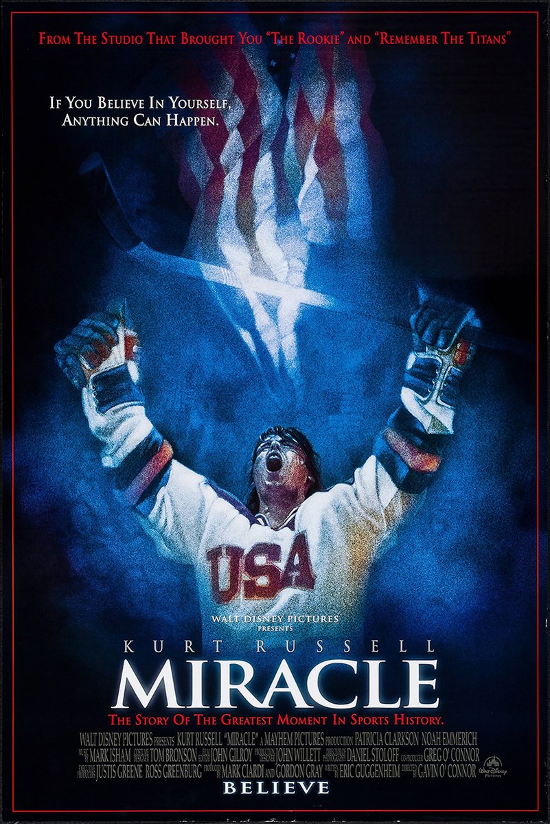 Miracle movie poster wall art print depicts a USA hockey player raising both arms beneath a glowing American flag in deep blue.