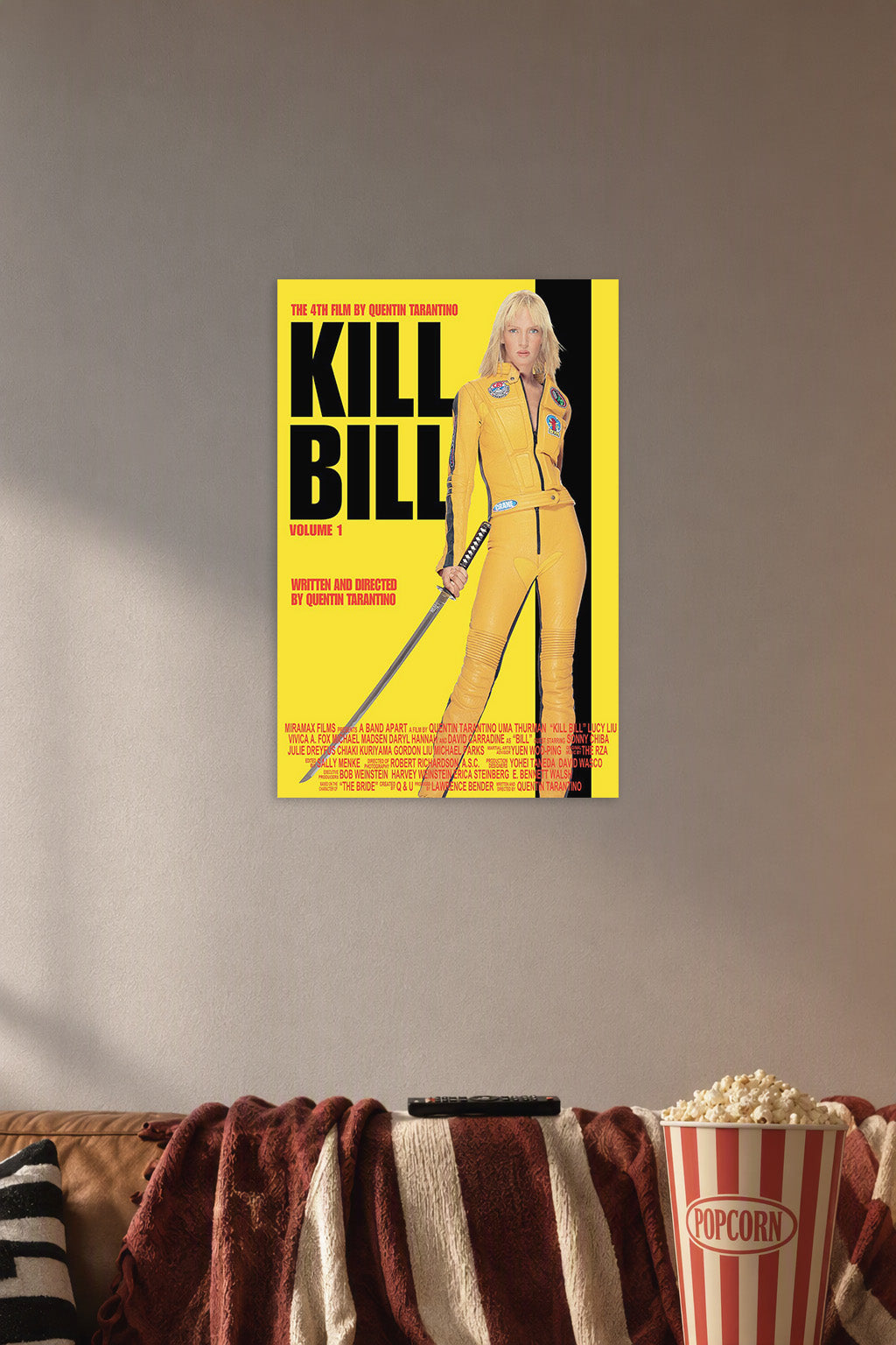 Uma Thurman Kill Bill Vol. 1 The Bride in a cozy movie room above a brown sofa with popcorn.