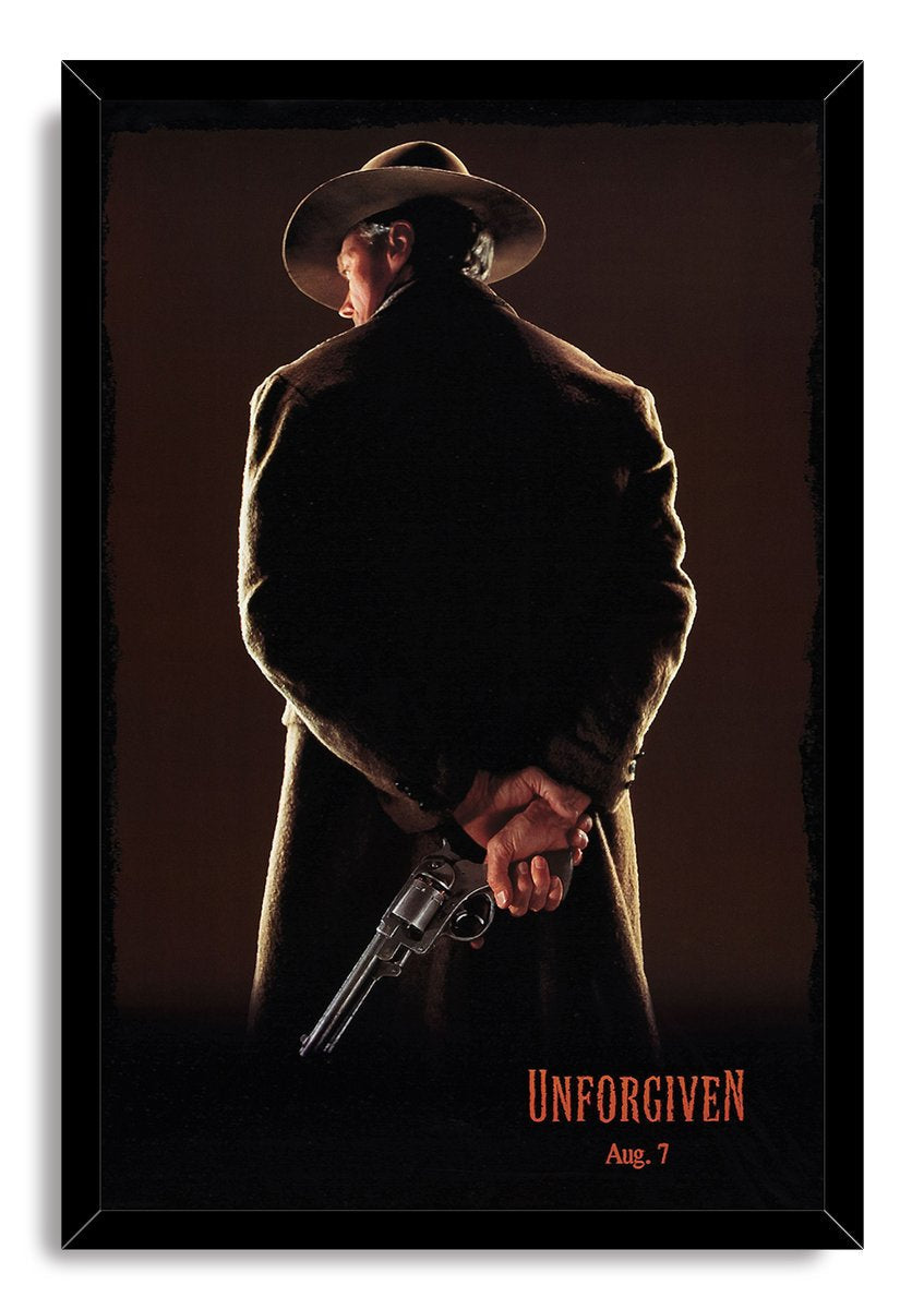 Unforgiven framed wall art print portrays a cowboy from behind with a hidden revolver, dark brown backdrop, and red lettering.