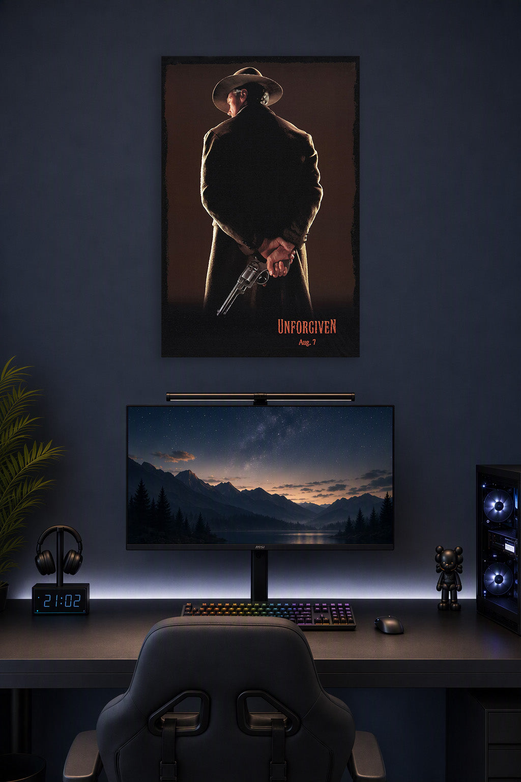 Unforgiven Movie Poster in a gaming desk setup above a monitor.