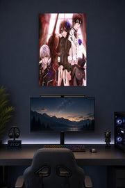 Vampire Knight Trio in a gaming desk setup above a monitor.
