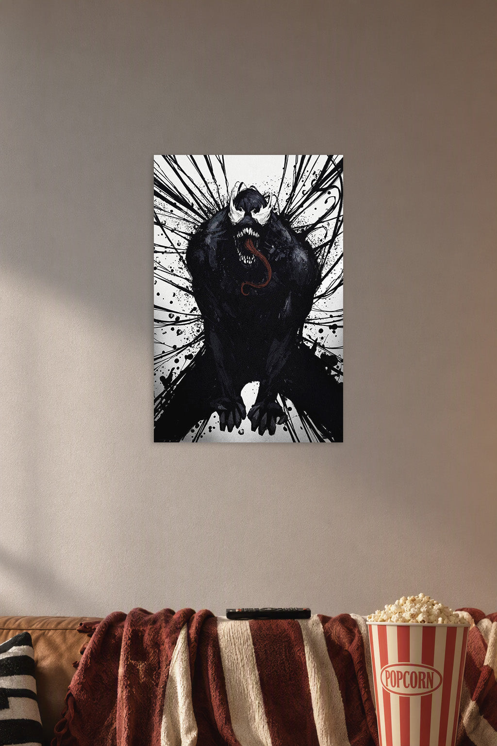 Venom in a cozy movie room above a brown sofa with popcorn.