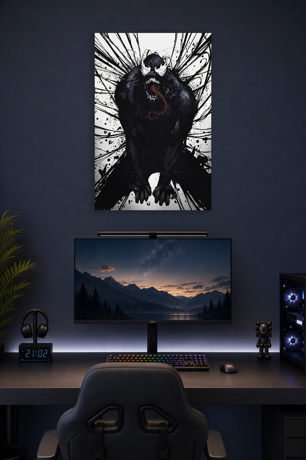 Venom in a gaming desk setup above a monitor.