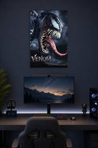 Venom in a gaming desk setup above a monitor.