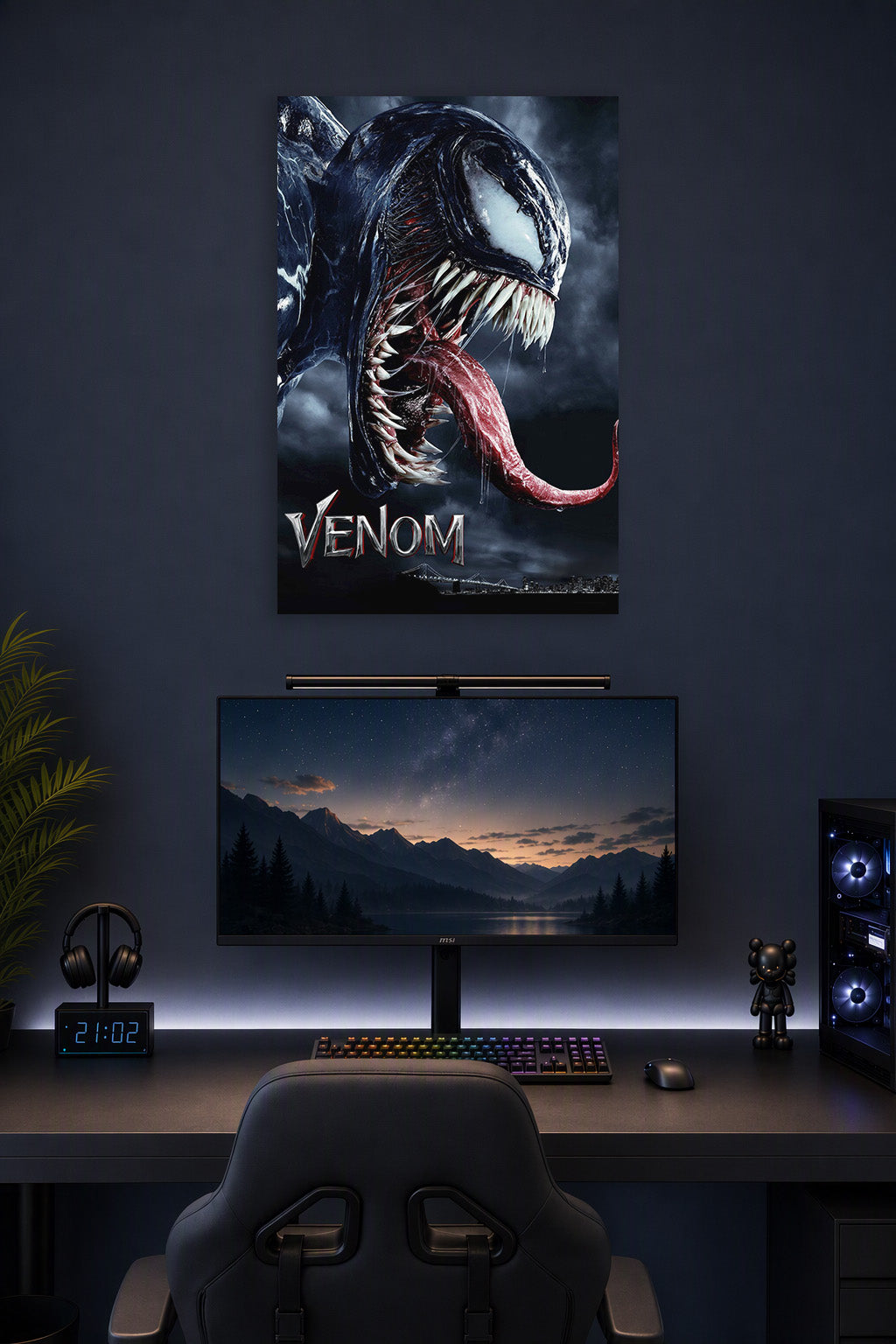 Venom in a gaming desk setup above a monitor.