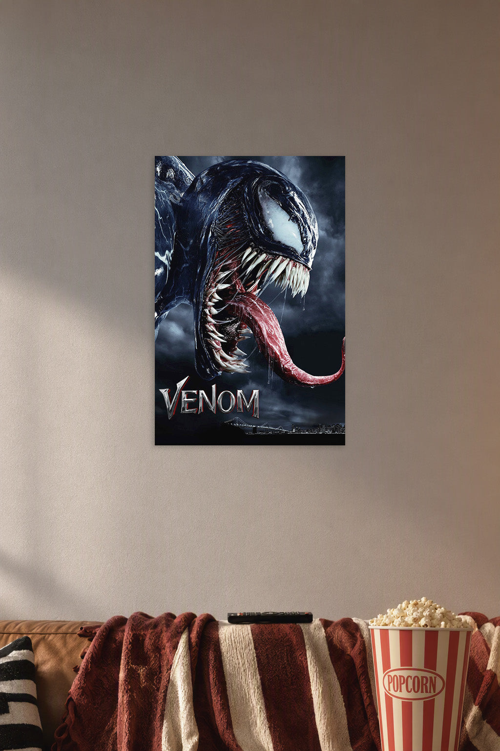 Venom in a cozy movie room above a brown sofa with popcorn.