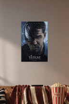 Venom Eddie Brock Tom Hardy in a cozy movie room above a brown sofa with popcorn.