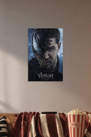 Venom Eddie Brock Tom Hardy in a cozy movie room above a brown sofa with popcorn.