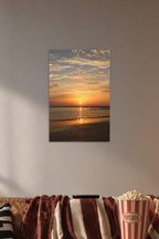 Vibrant Sunset Seascape in a cozy movie room above a brown sofa with popcorn.