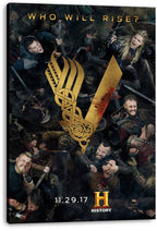 Vikings canvas wall art print displays battling warriors and a blood-marked gold V emblem, mounted on a thick black-edged canvas.