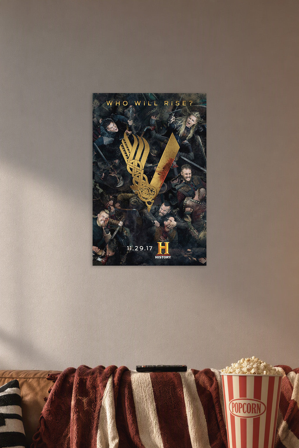 Vikings TV Series Battle Scene in a cozy movie room above a brown sofa with popcorn.