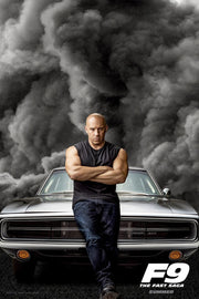 Vin Diesel F9 The Fast Saga poster with Dominic Toretto standing arms crossed before a silver muscle car and storm clouds.
