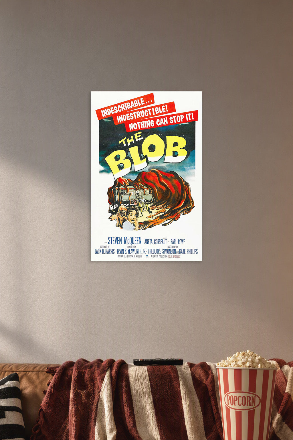 Vintage Science Fiction Horror Movie Poster in a cozy movie room above a brown sofa with popcorn.
