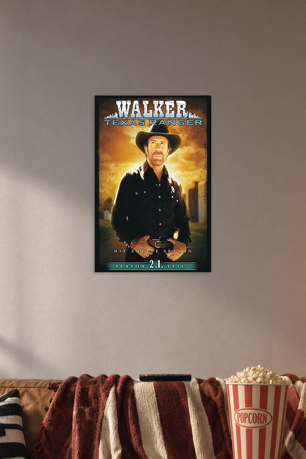 Walker, Texas Ranger in a cozy movie room above a brown sofa with popcorn.