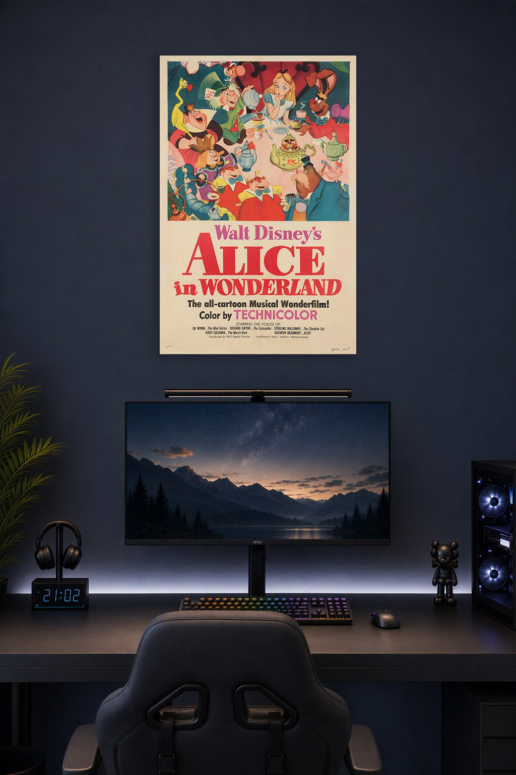 Walt Disney's Alice in Wonderland Movie Poster in a gaming desk setup above a monitor.