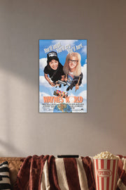 Wayne's World Movie in a cozy movie room above a brown sofa with popcorn.