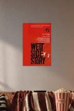 West Side Story Movie Poster in a cozy movie room above a brown sofa with popcorn.