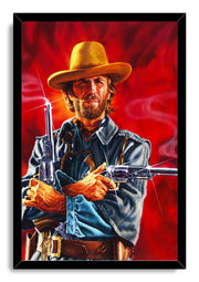 Western gunslinger framed wall art print features a stern bearded cowboy in a yellow hat, blue jacket, and gun belt holding revolvers.