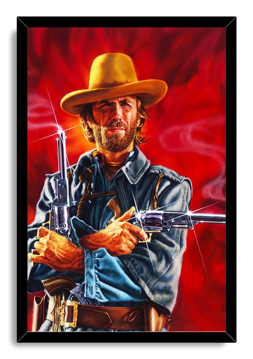 Western gunslinger framed wall art print features a stern bearded cowboy in a yellow hat, blue jacket, and gun belt holding revolvers.