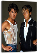 Wham! canvas wall art print displays George Michael in a white mesh tank and Andrew Ridgeley in a dark jacket.
