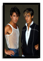 Wham! framed wall art print presents George Michael and Andrew Ridgeley in a studio portrait within a black frame.