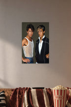 Wham! George Michael and Andrew Ridgeley in a cozy movie room above a brown sofa with popcorn.