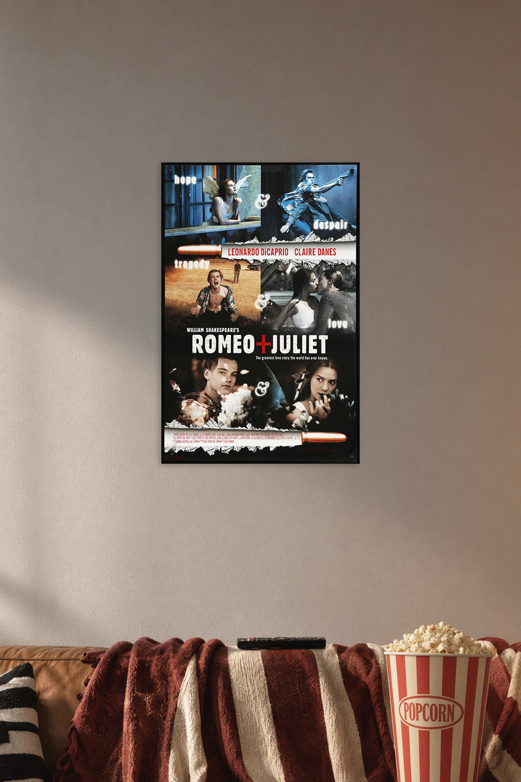 William Shakespeare's Romeo + Juliet in a cozy movie room above a brown sofa with popcorn.