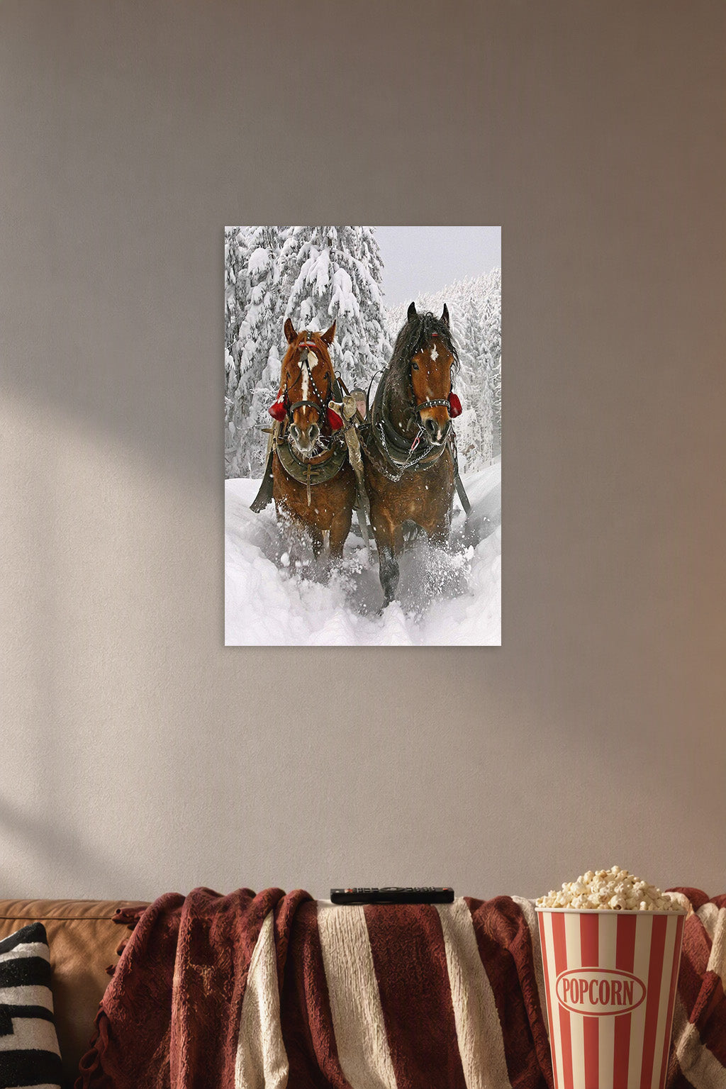Winter Horses Sleigh Ride in a cozy movie room above a brown sofa with popcorn.