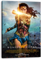 Wonder Woman canvas wall art print presents the armored heroine deflecting a golden blast amid flying debris, with title and release text.