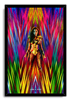Wonder Woman framed wall art print depicts a warrior in gleaming gold armor holding swords amid bold geometric strokes in pink, blue, yellow, and green.