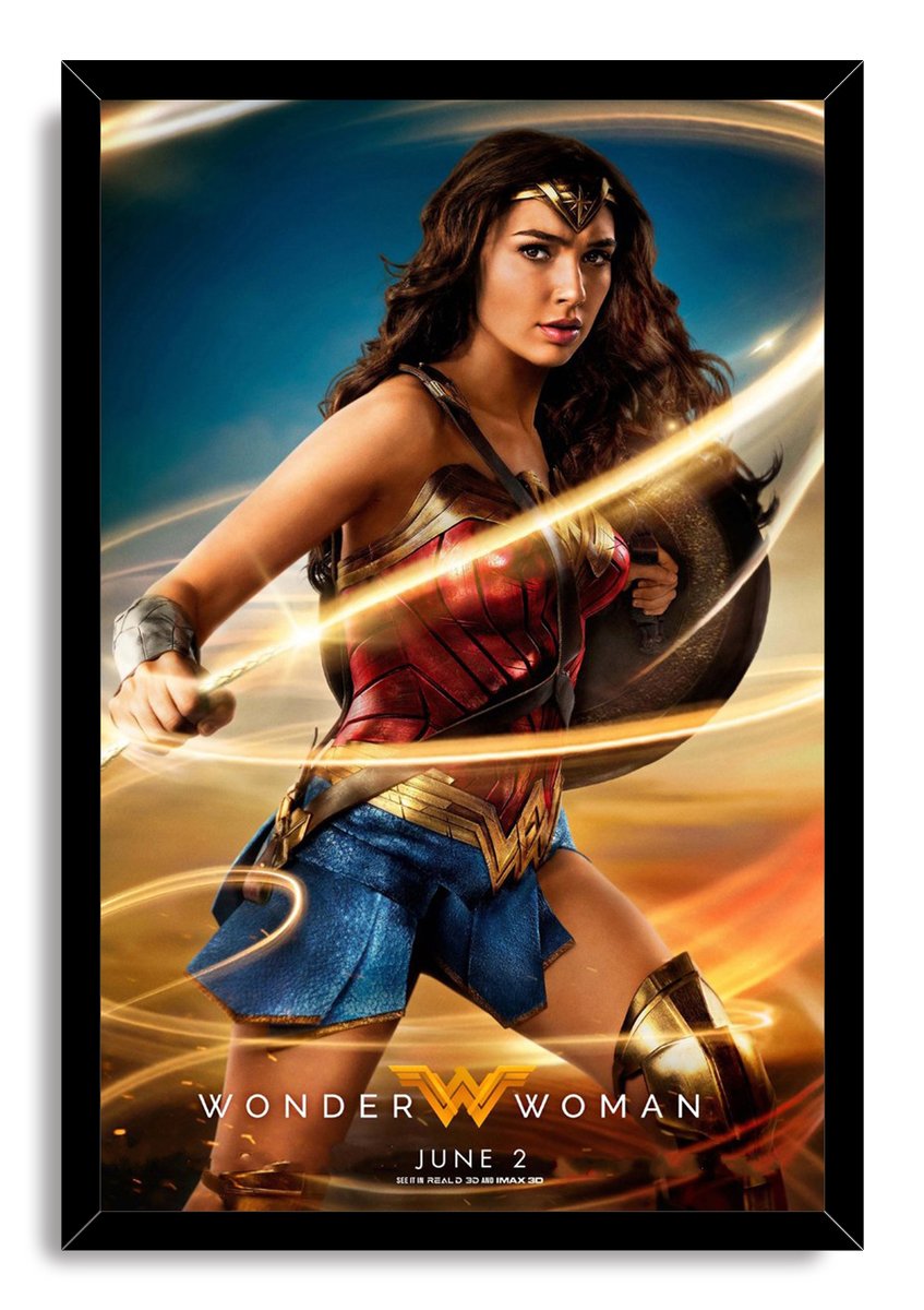 Wonder Woman framed wall art print presents the shield-bearing heroine amid golden lasso trails, set in a black frame.