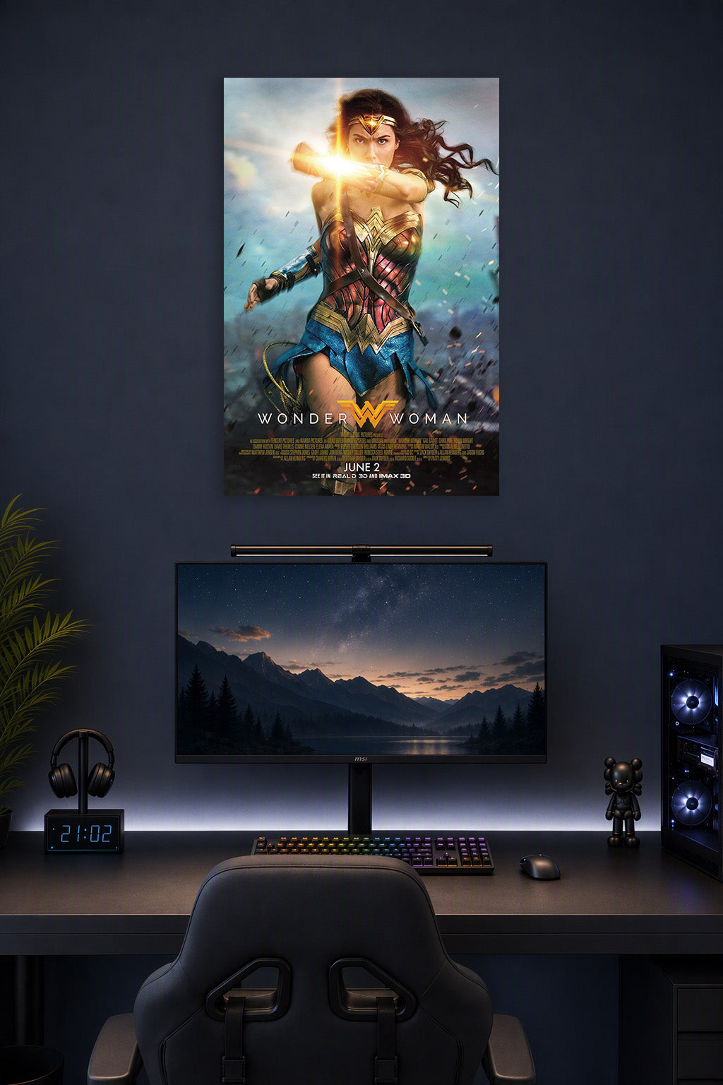 Wonder Woman in a gaming desk setup above a monitor.