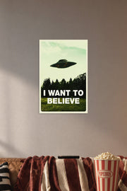 X-Files 'I Want To Believe' UFO in a cozy movie room above a brown sofa with popcorn.